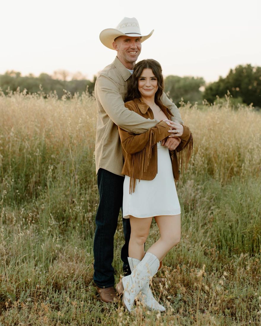 Western-style engagement shoot with soft glam makeup and half-up waves