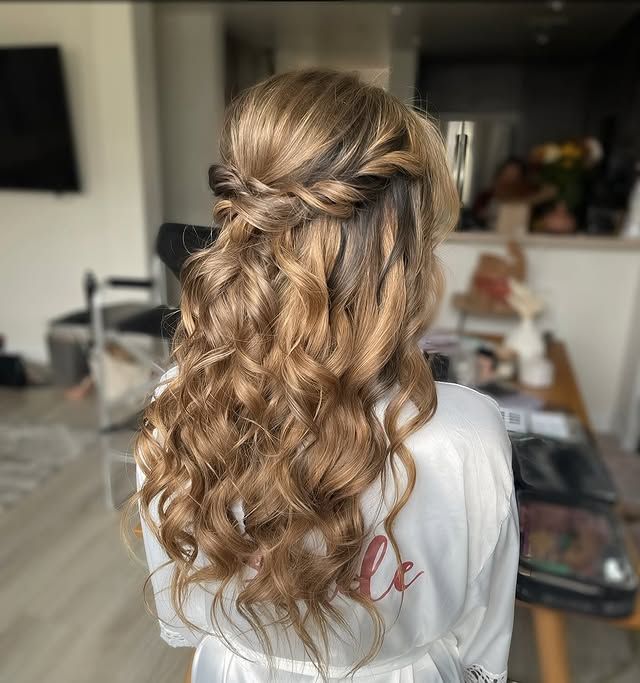 Half-up braided crown over long curls